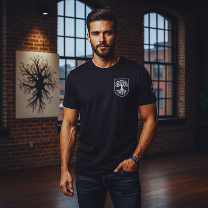 Studio close-up, black organic t-shirt with shield tree-and-roots crest over heart; modern.