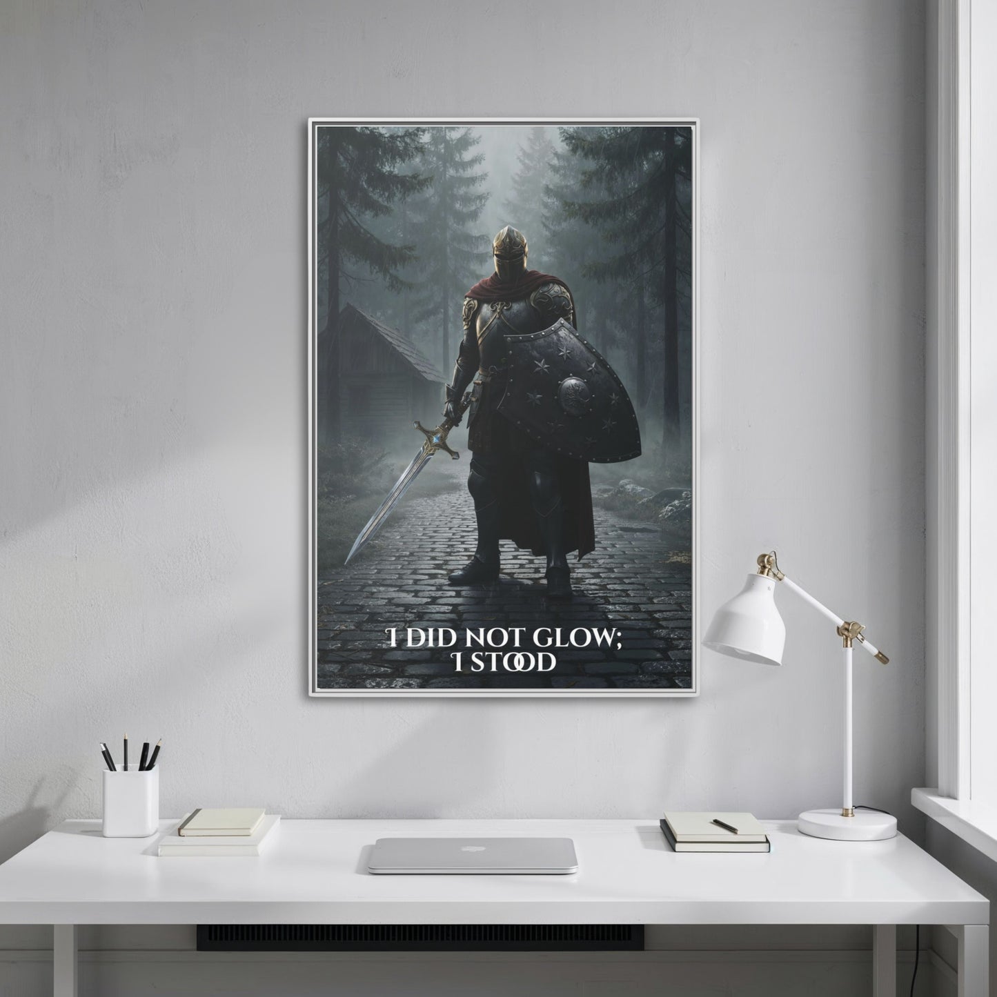 Vertical knight-in-forest canvas with the quote ‘I did not glow; I stood’ hanging straight-on above a minimalist white desk.
