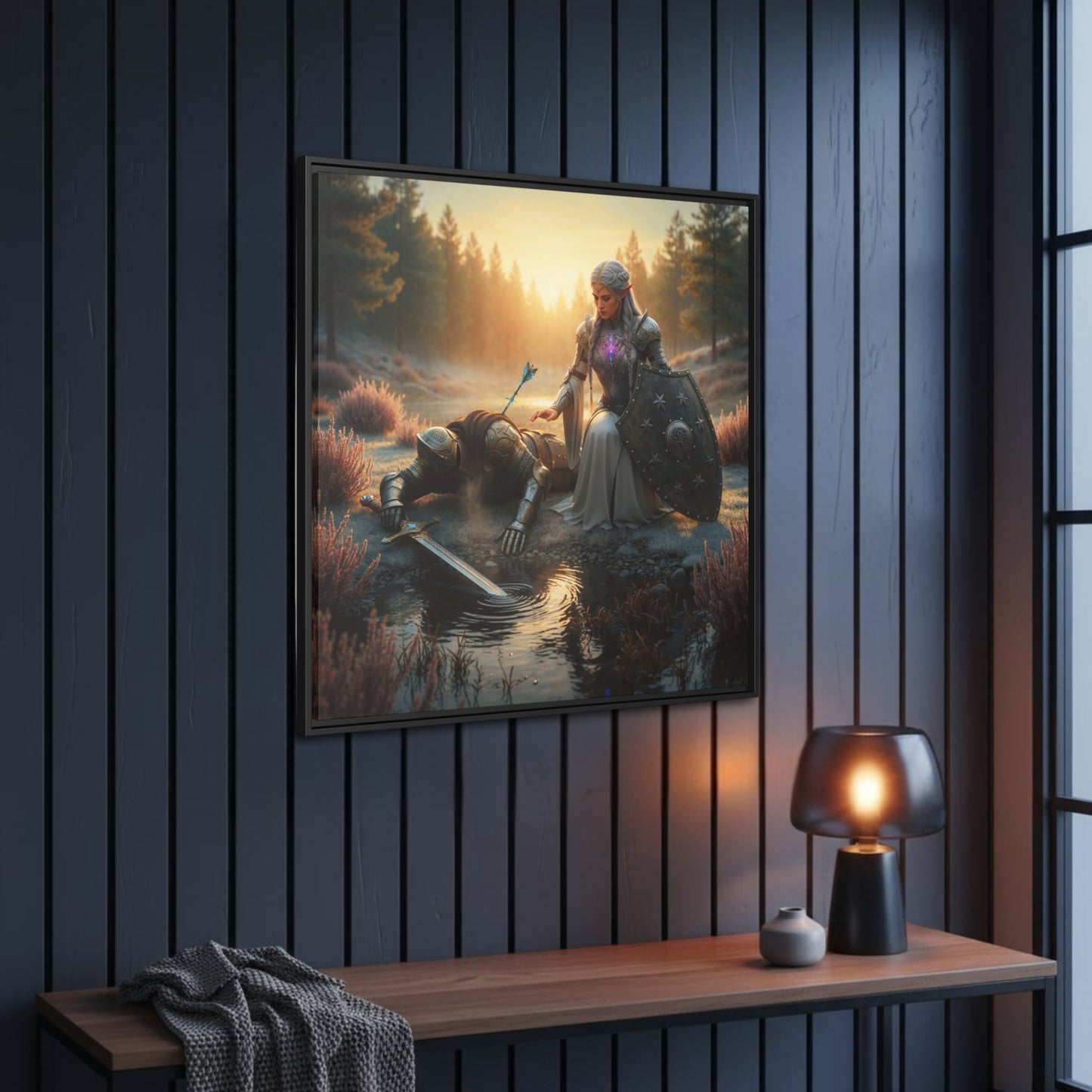 Angled view of black framed Lumera and fallen Knight canvas on a dark panelled hallway wall above a console with warm lamp.
